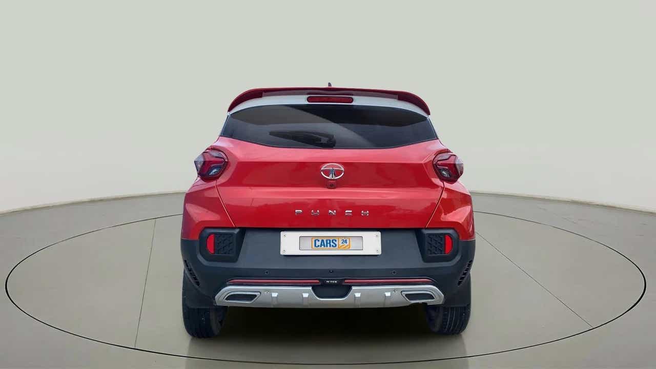 Rear view of a Calypso Red with White Roof Tata Punch