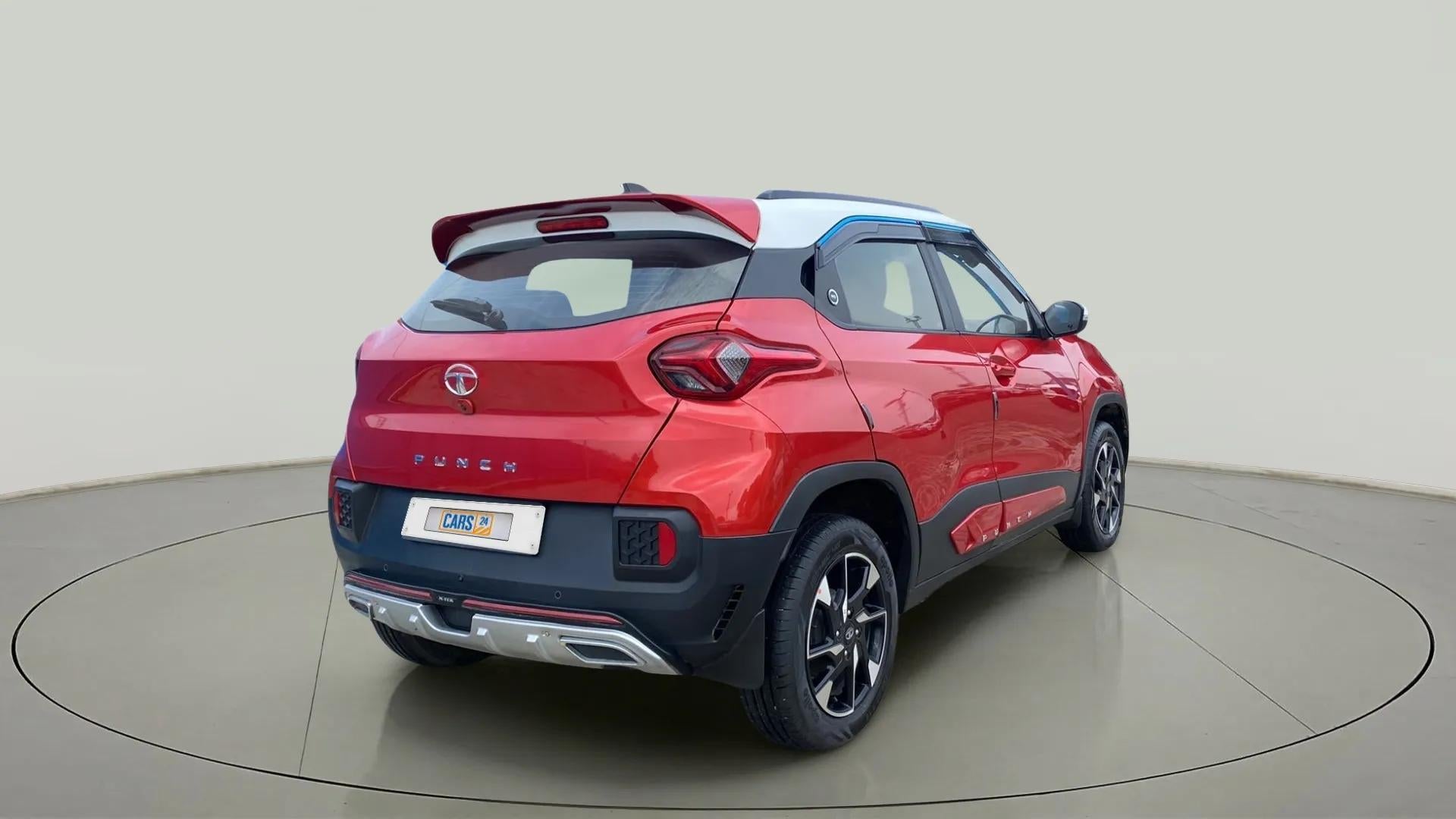 Rear three-quarter view of a Calypso Red with White Roof Tata Punch