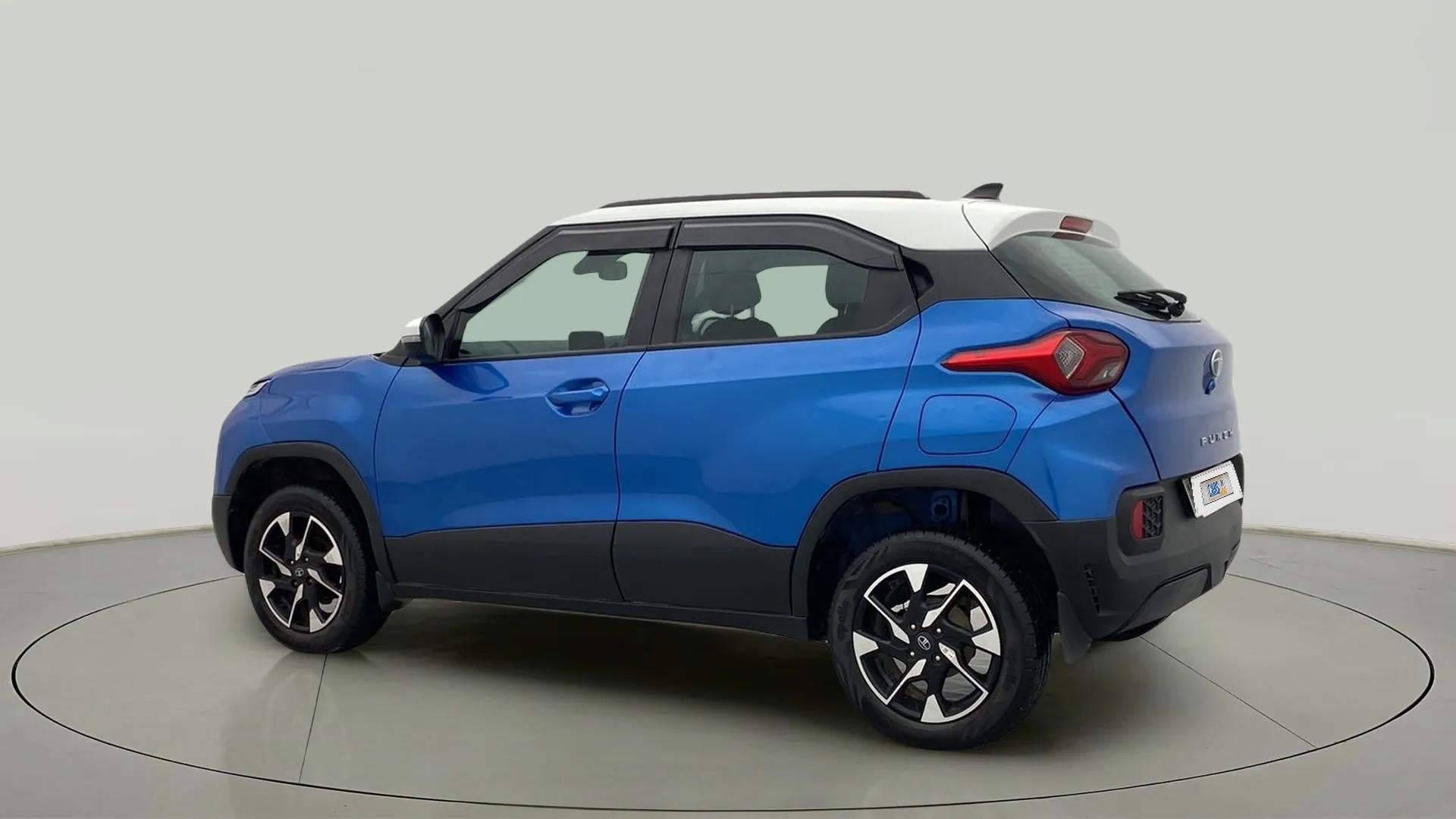 Rear three-quarter view of a Tornado Blue with White Roof Tata Punch