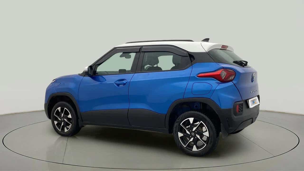 Rear three-quarter view of a Tornado Blue with White Roof Tata Punch
