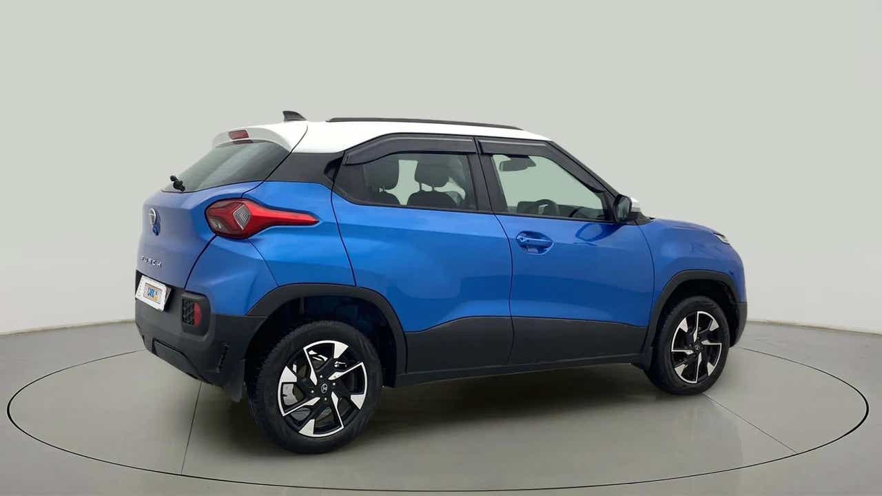Rear three-quarter view of a Tornado Blue with White Roof Tata Punch