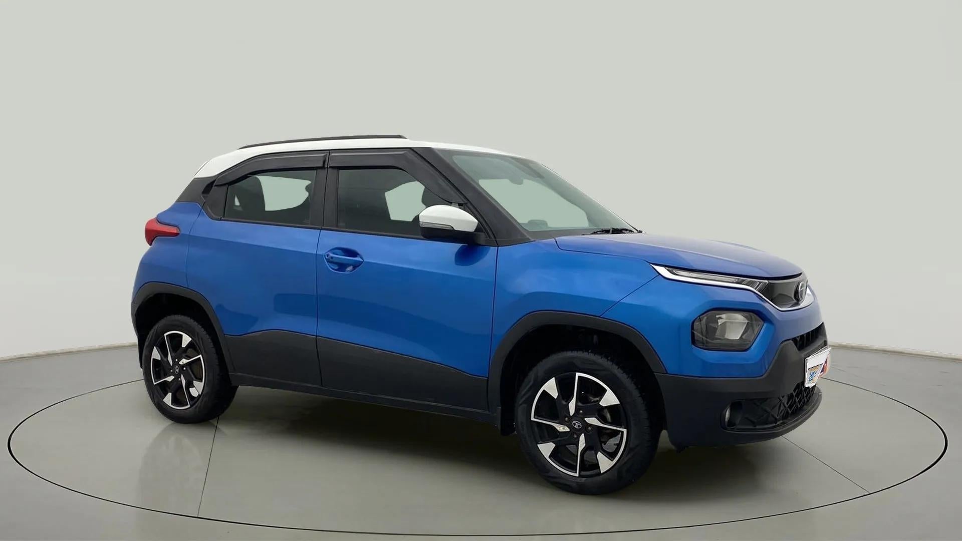 Side profile of a Tornado Blue with White Roof Tata Punch