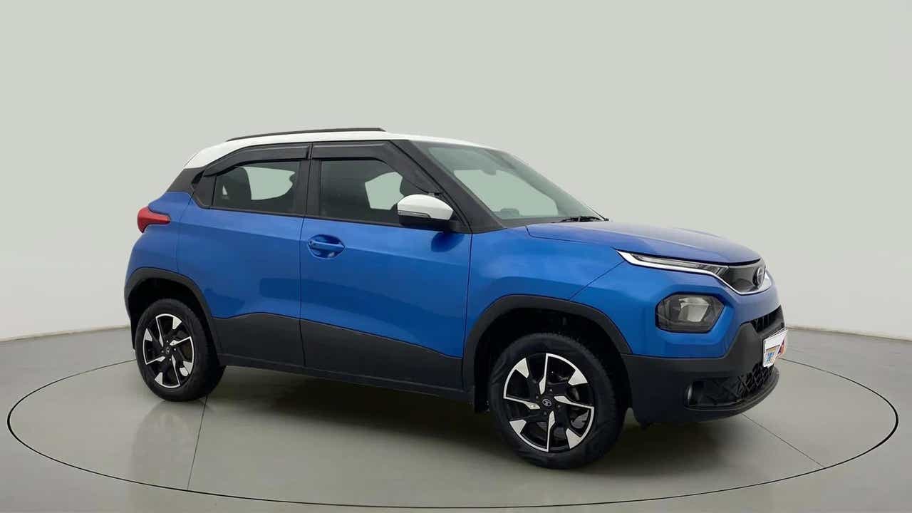 Side profile of a Tornado Blue with White Roof Tata Punch