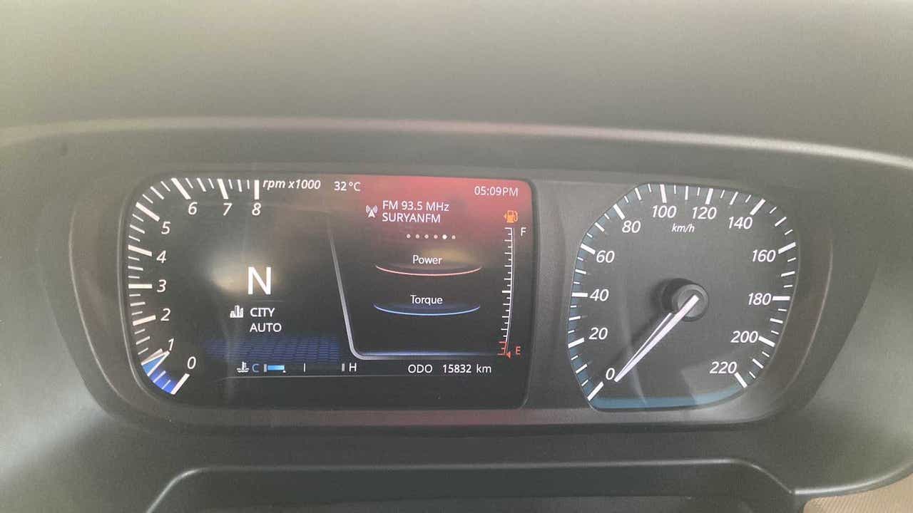 Instrument cluster of a Tata Punch showing digital display and speedometer