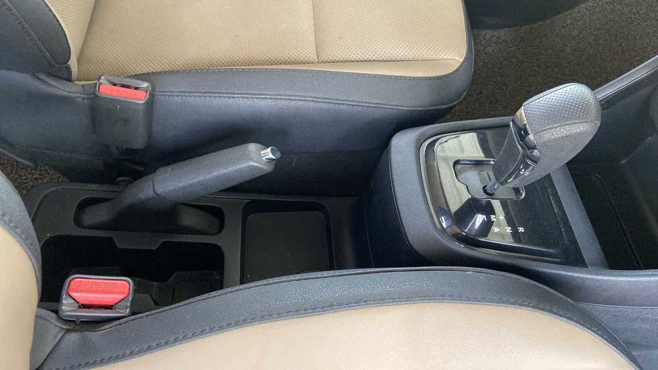 Center console of a Tata Punch showing gear shifter and handbrake