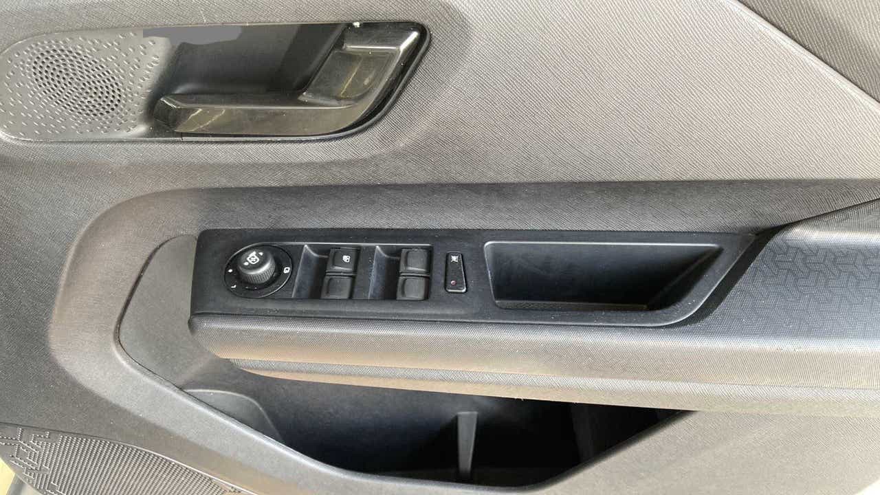 Interior door panel controls of a Tata Punch