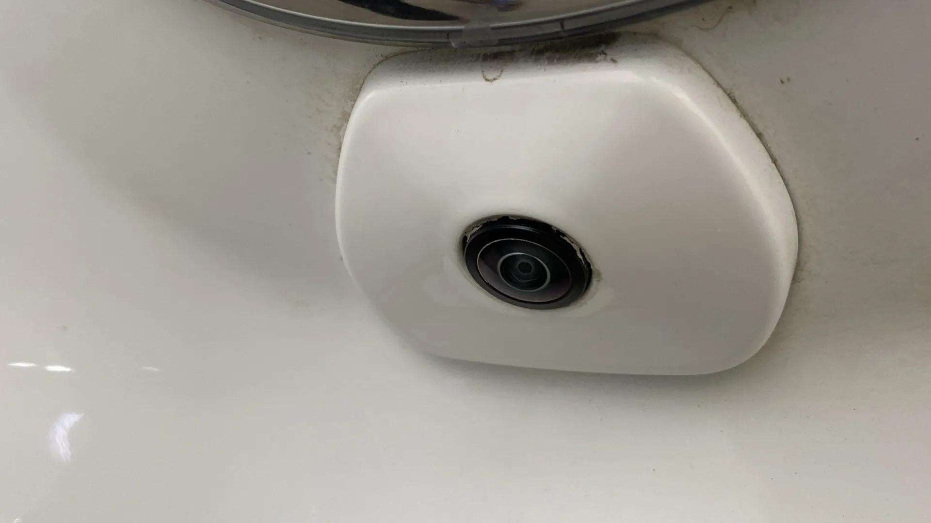 Close-up of a orcus-white Tata Punch reverse camera