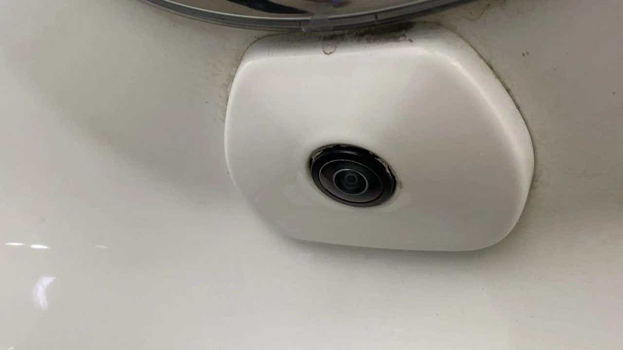 Close-up of a orcus-white Tata Punch reverse camera