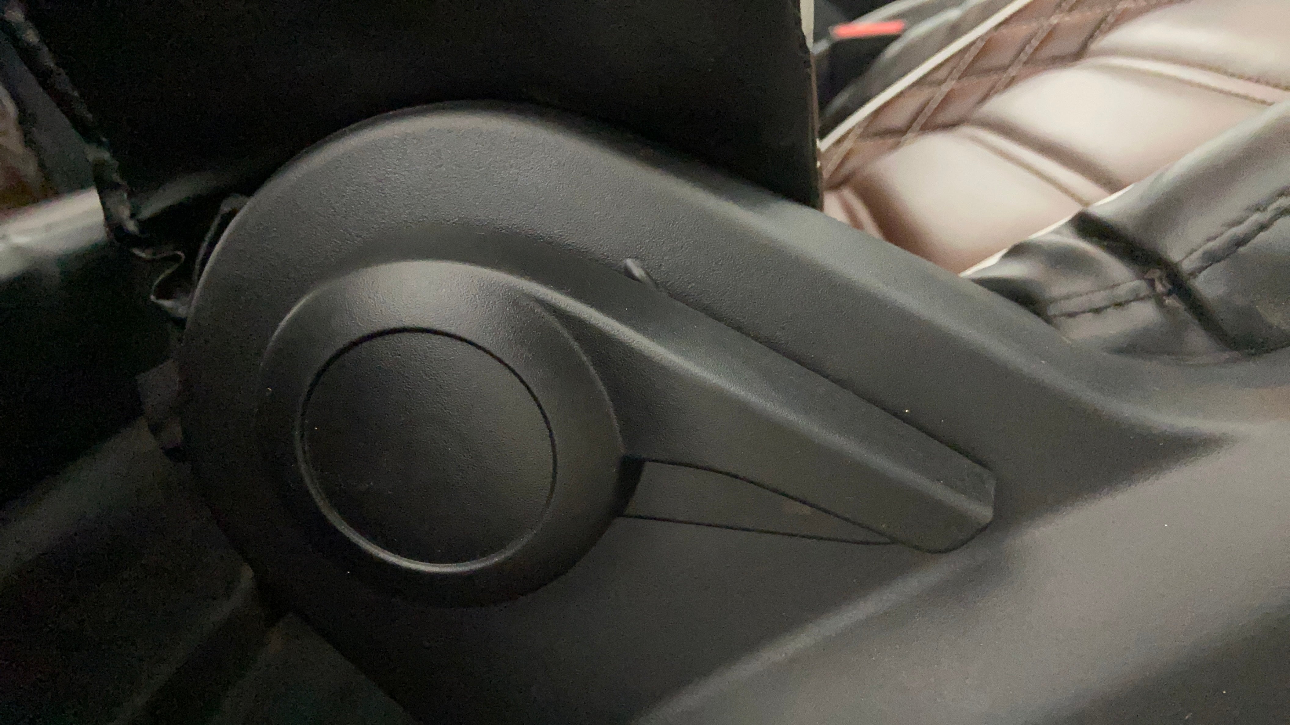 Close-up of a seat adjustment knob in a Tata Punch