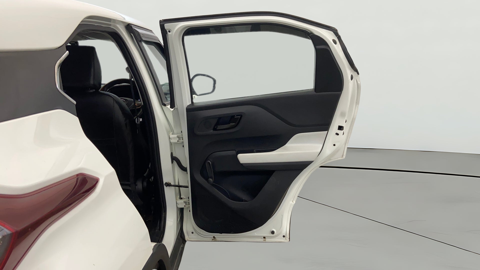 Rear left door open view of a Orcus White Tata Punch