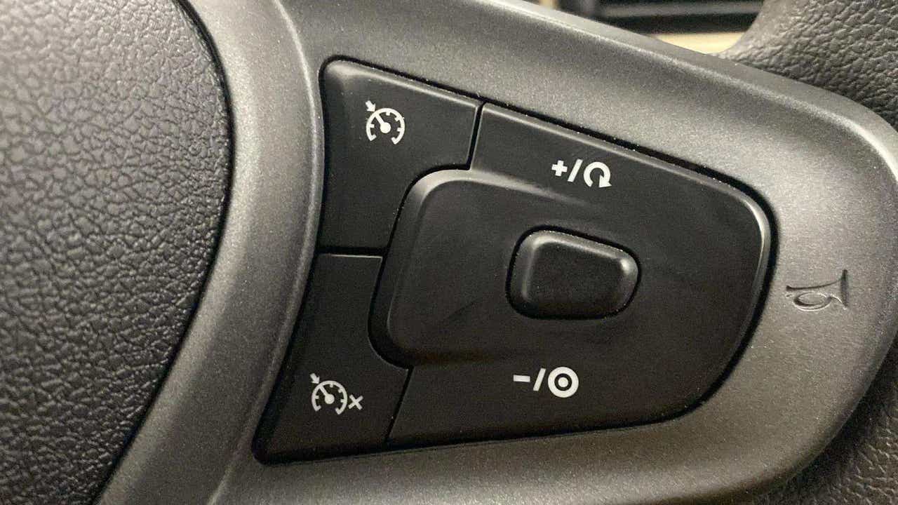 Steering wheel cruise control buttons of a Tata Punch
