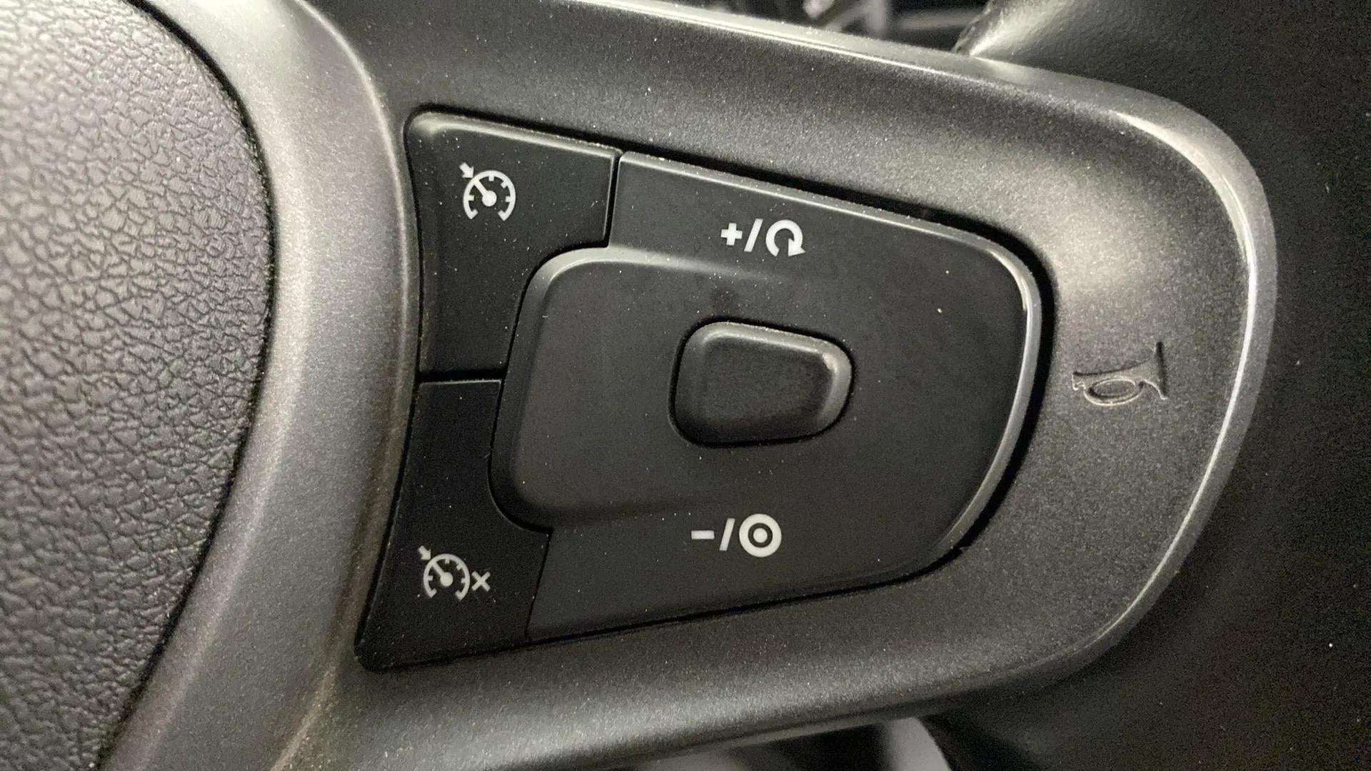 Steering wheel cruise control buttons of a Tata Punch