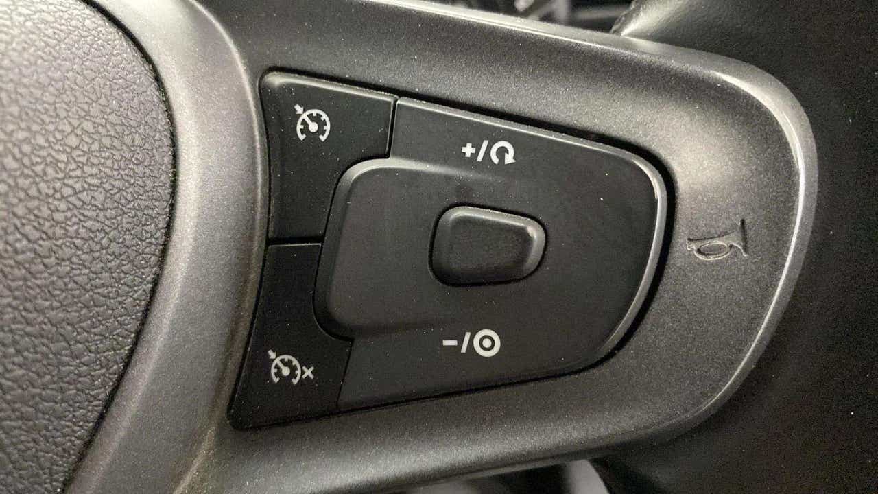 Steering wheel cruise control buttons of a Tata Punch