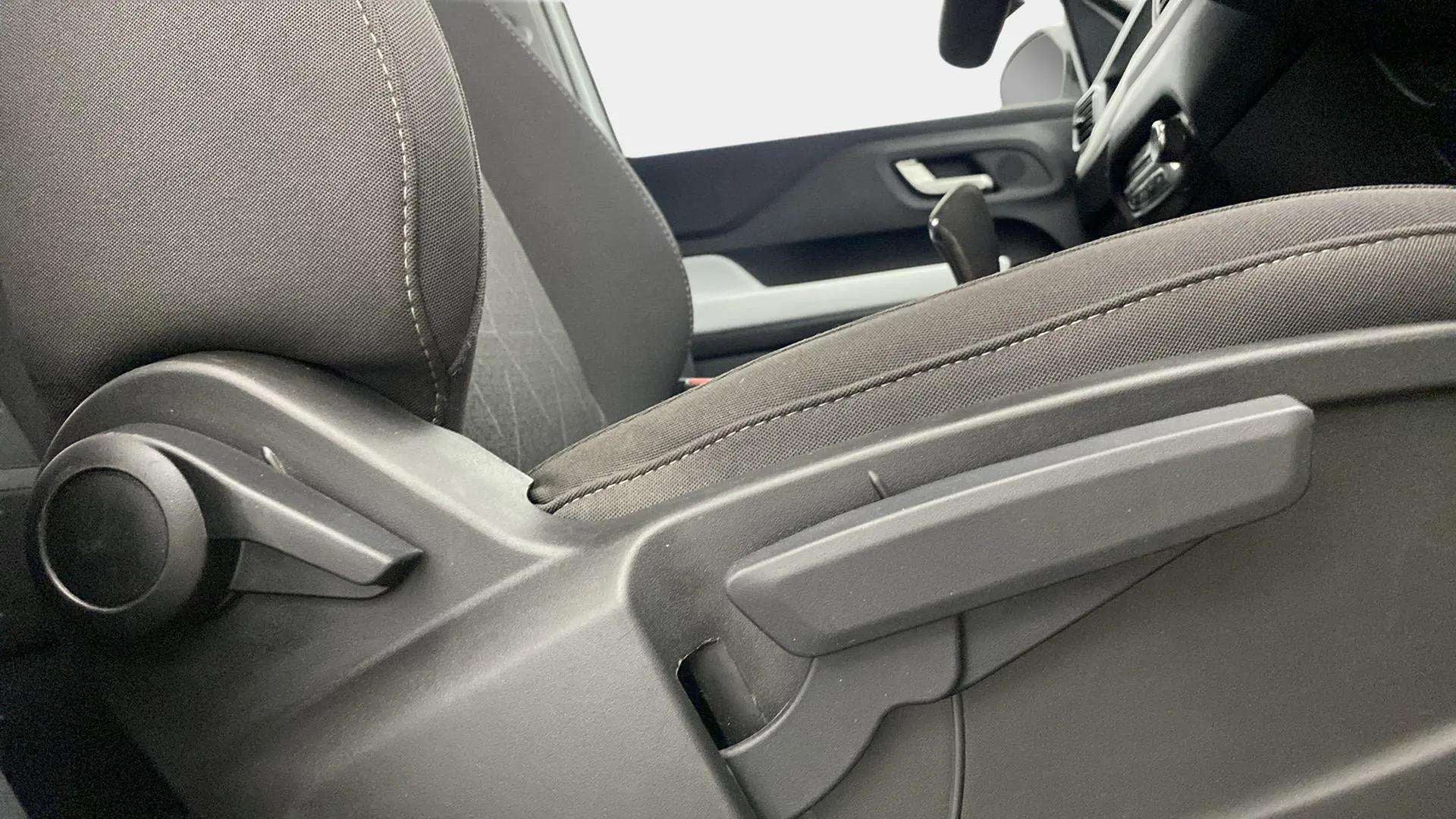 Close-up of a seat adjustment lever and knob in a Tata Punch