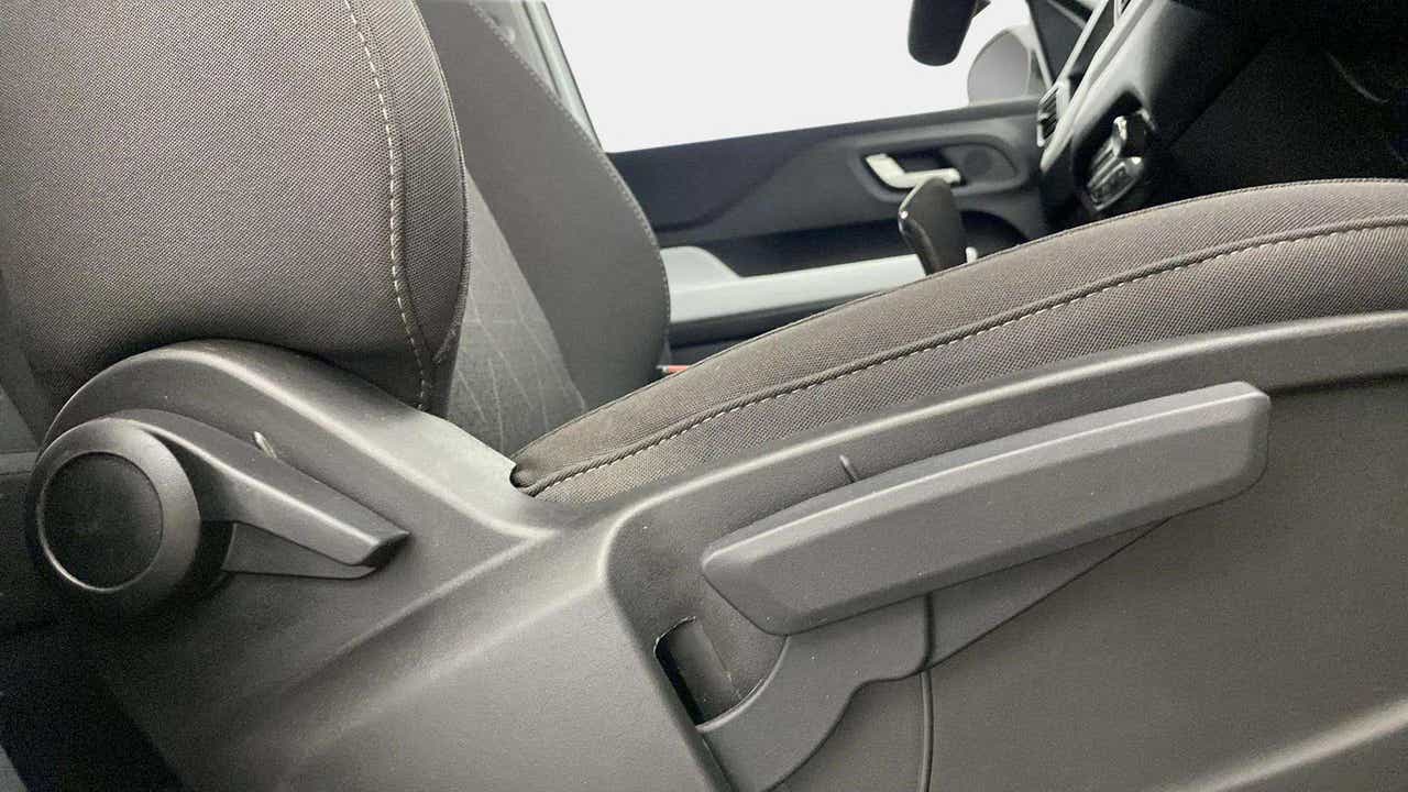 Close-up of a seat adjustment lever and knob in a Tata Punch