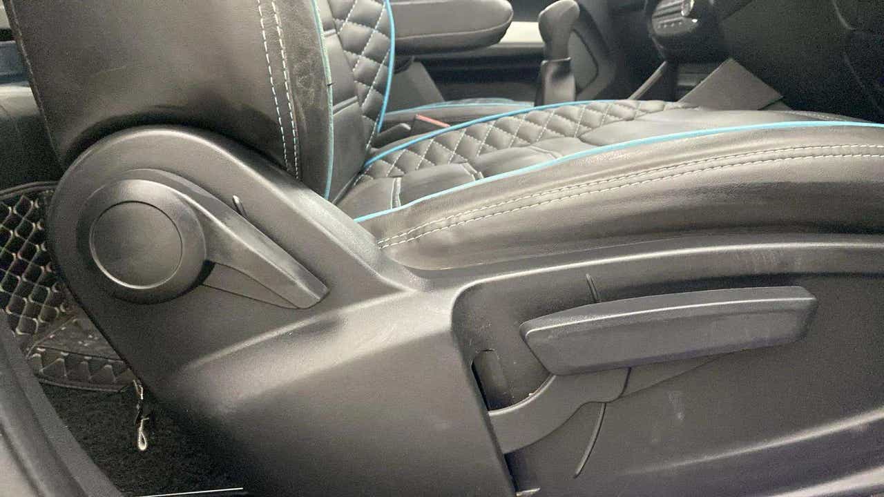 Driver seat adjustment levers of a Tata Punch