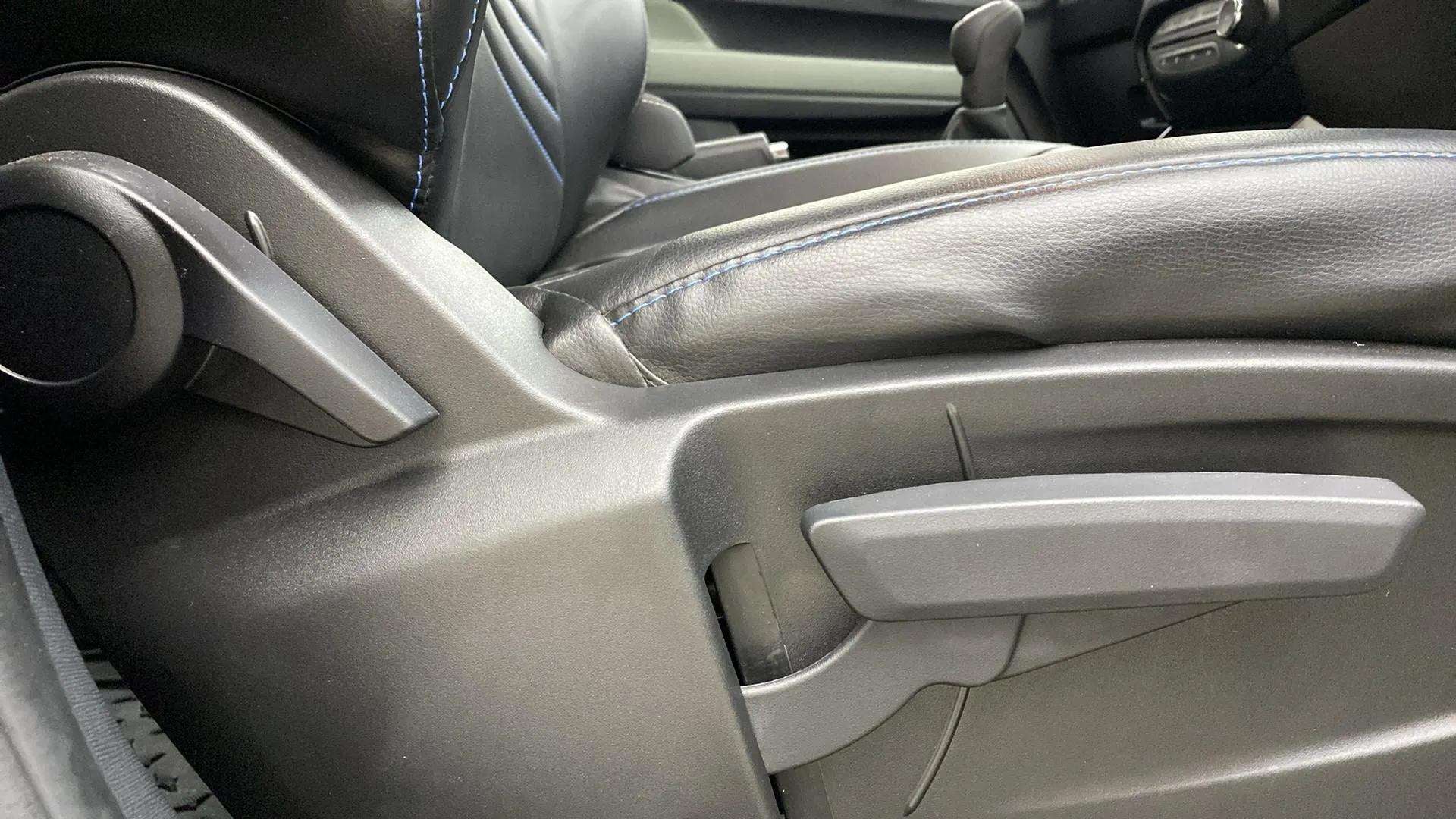 Close-up of driver seat adjustment levers of a Tata Punch