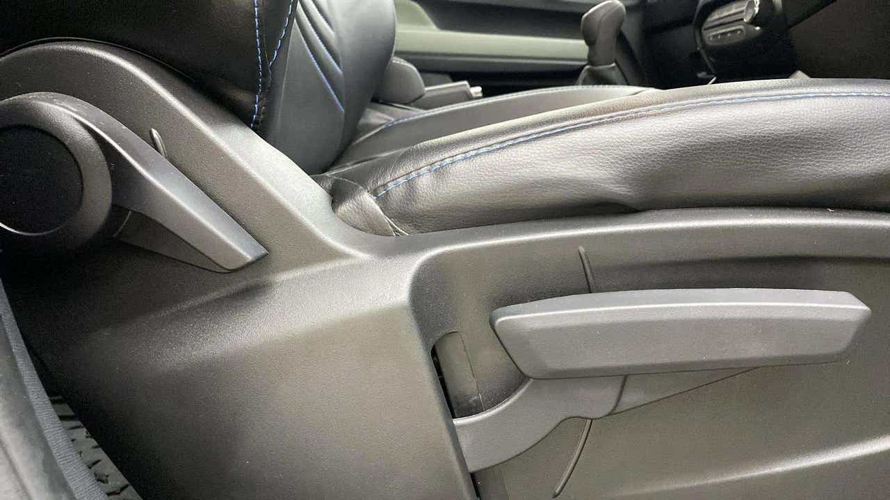 Close-up of driver seat adjustment levers of a Tata Punch