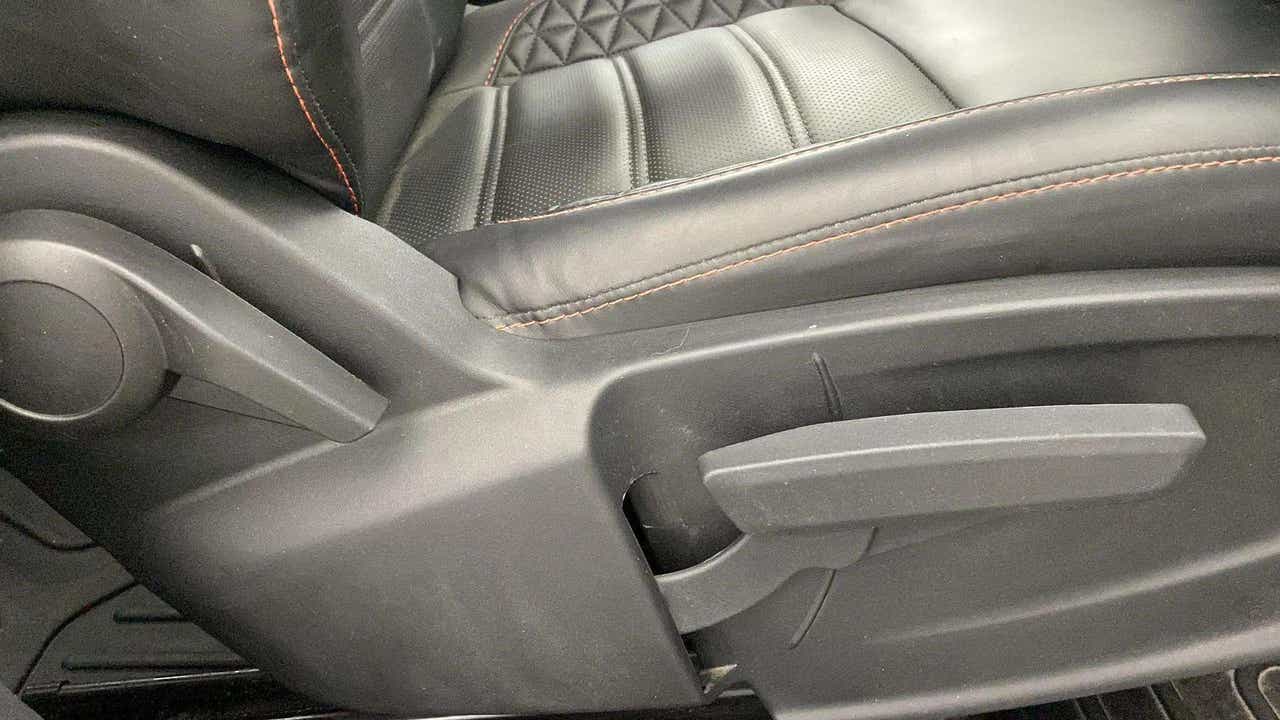 Close-up of the seat adjustment lever and stitching on a Tata Punch