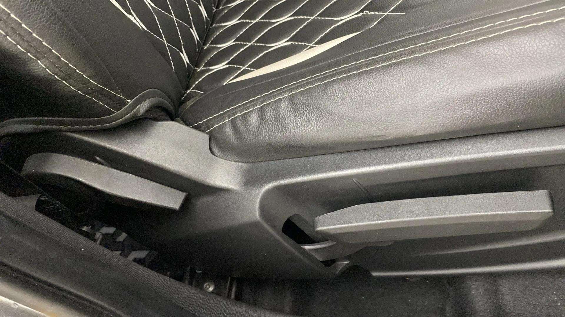 Close-up of seat adjustment lever in a Tata Punch