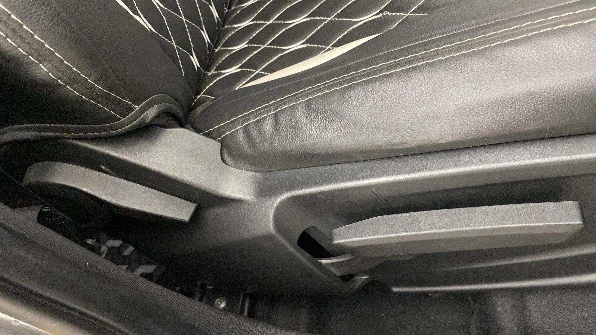 Close-up of seat adjustment lever in a Tata Punch