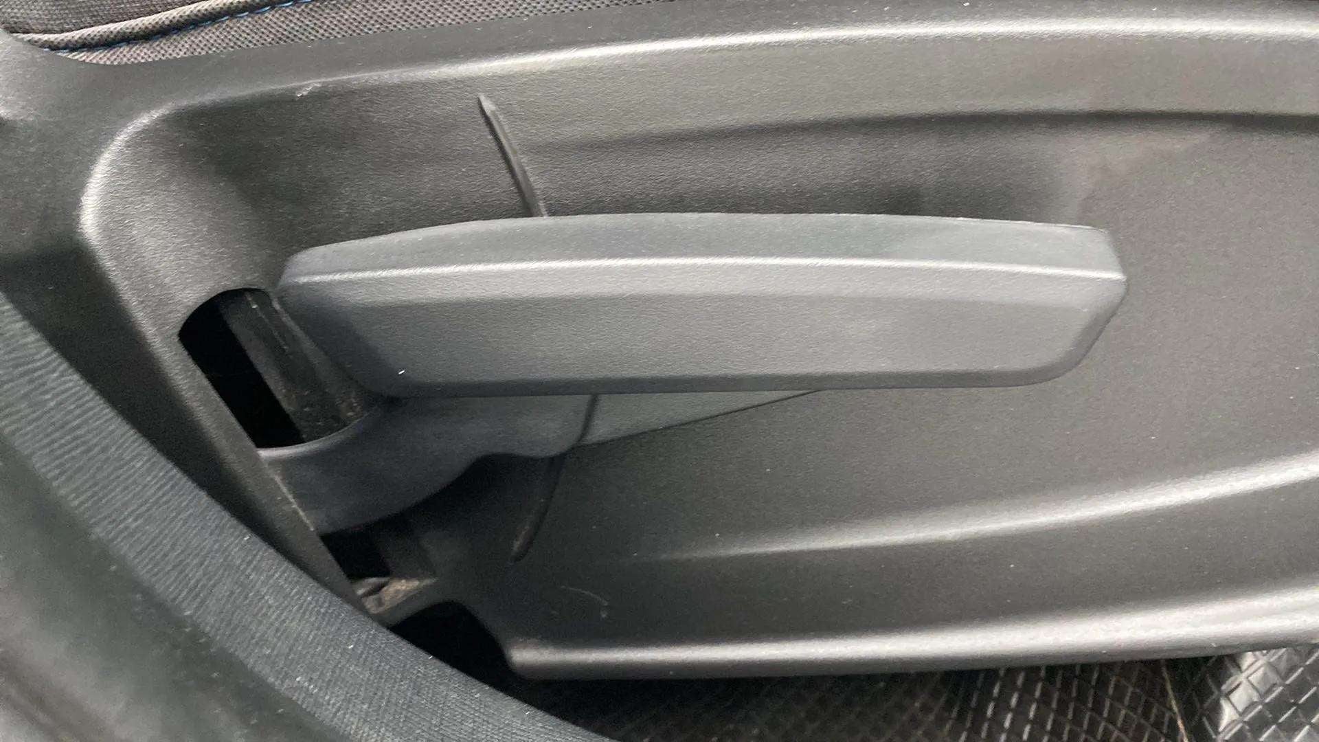 Close-up of car seat adjustment lever in a Tata Punch