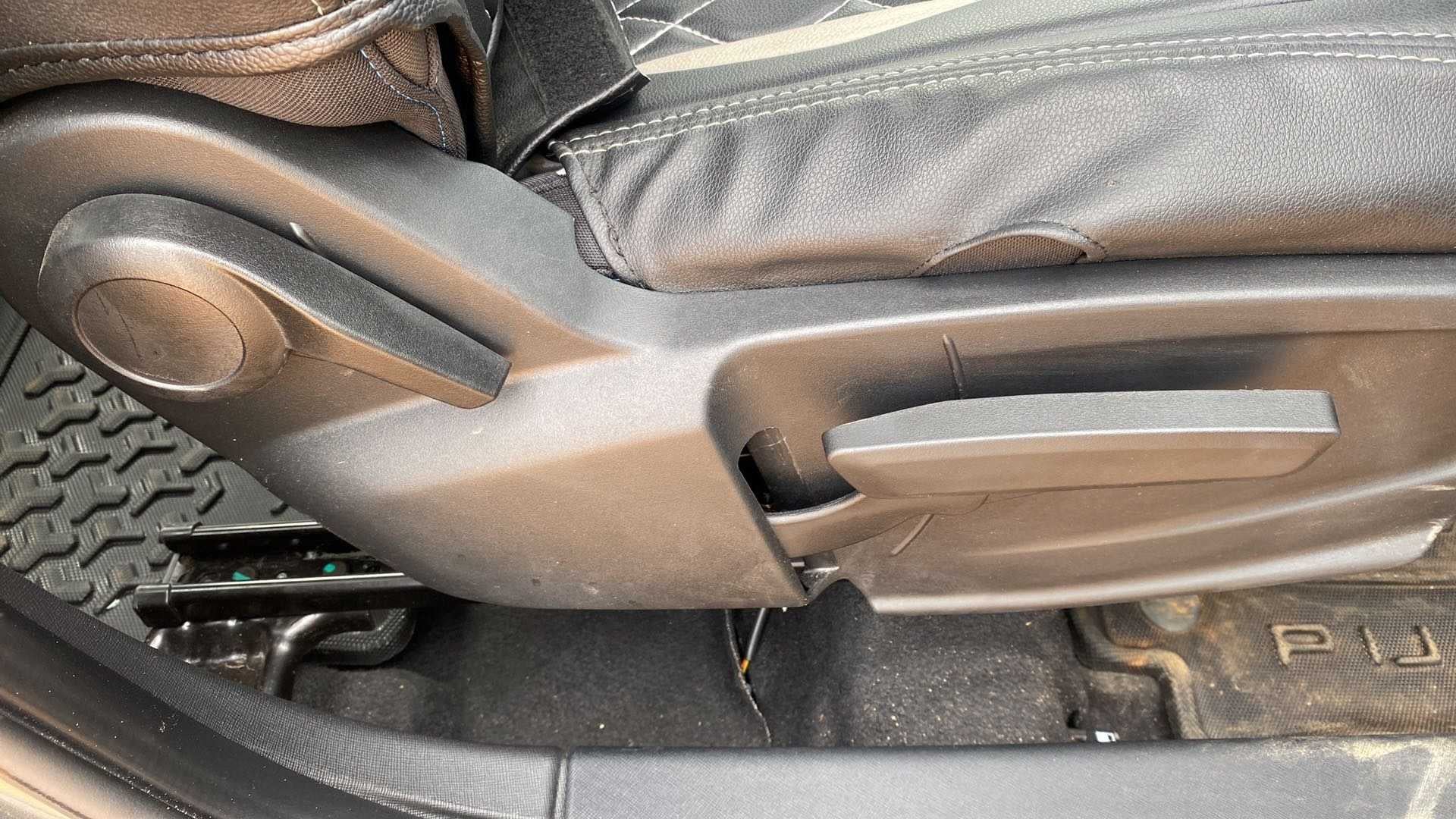 Driver seat adjuster and floor area of a Tata Punch
