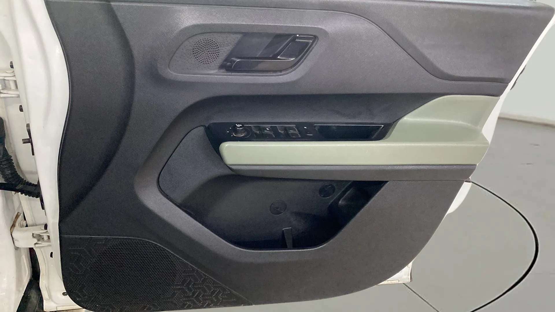 Interior driver door panel of a Tata Punch