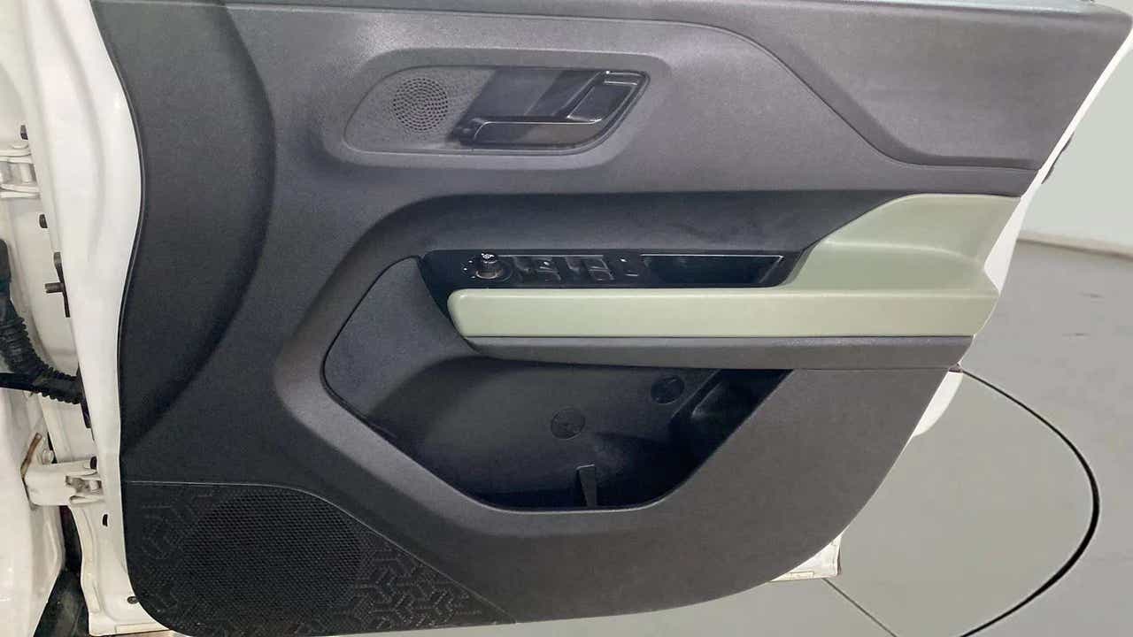 Interior driver door panel of a Tata Punch