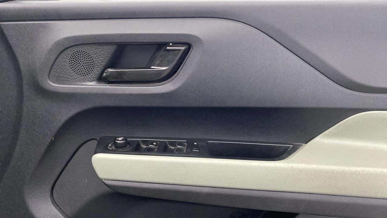 Interior driver-side door panel of a Tata Punch