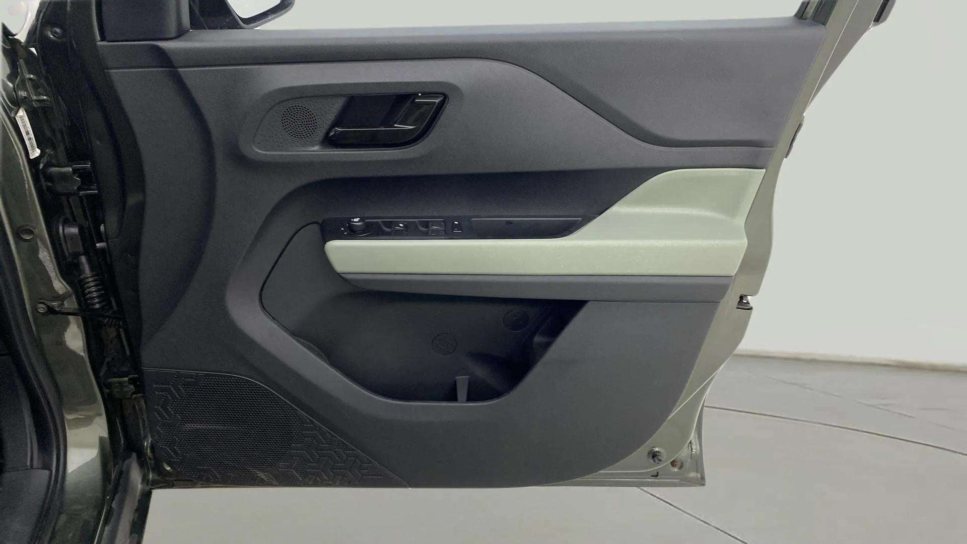 Interior driver side door panel of a Tata Punch