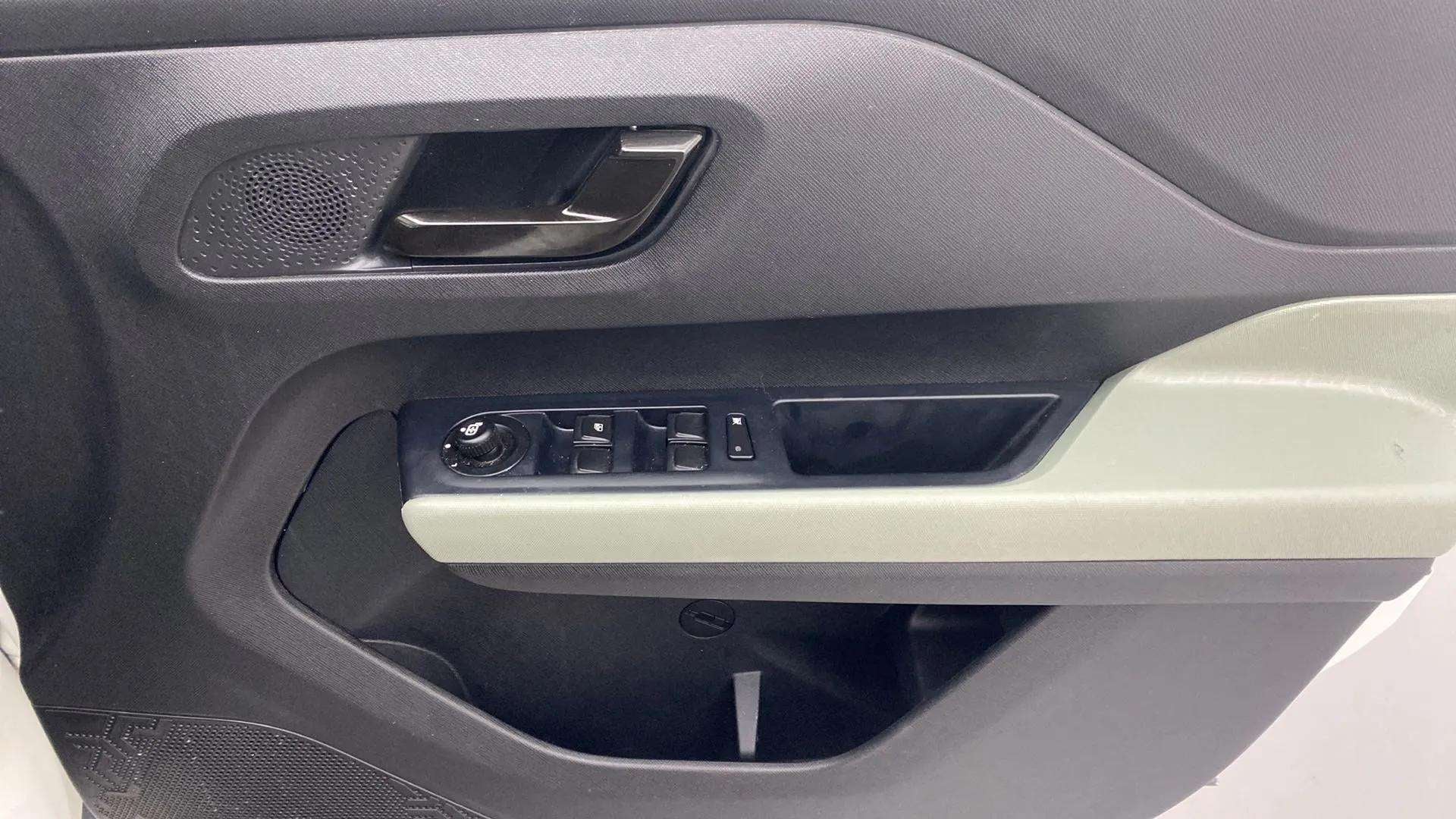 Front door armrest and controls of a Tata Punch