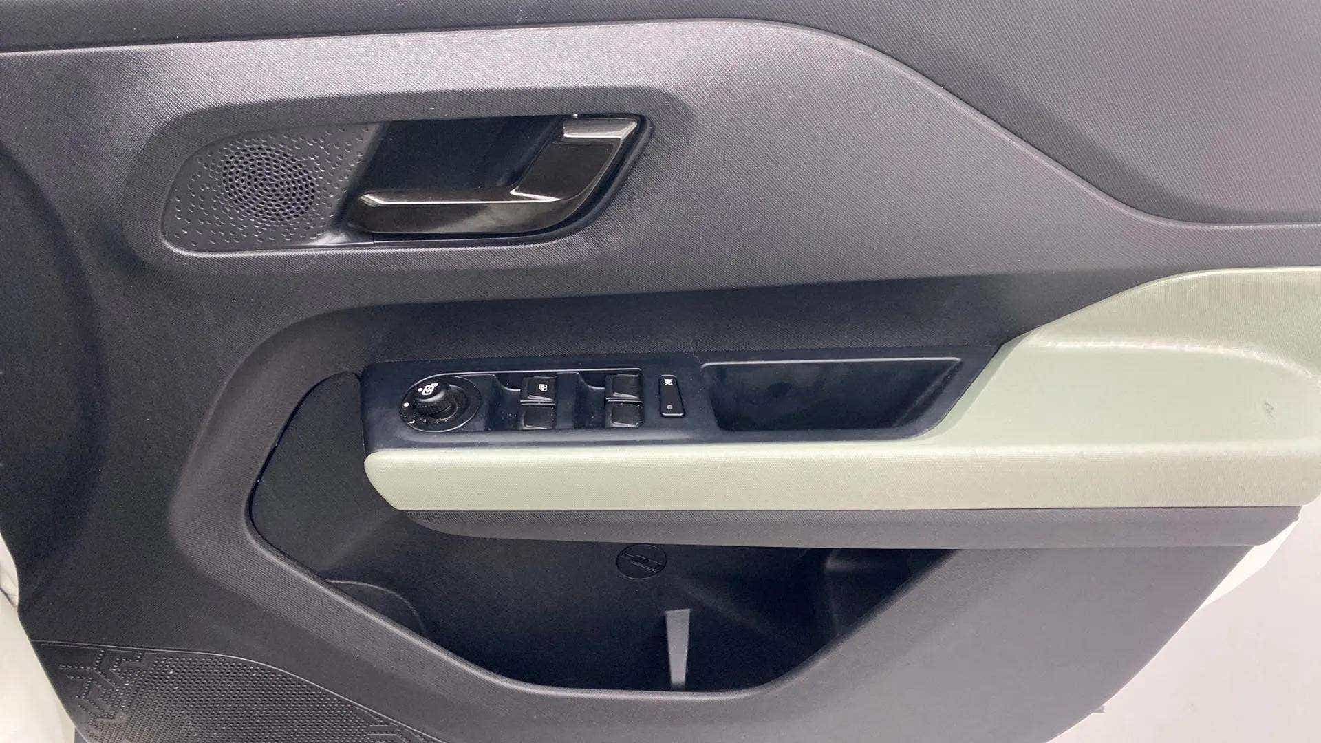 Front door armrest and controls of a Tata Punch