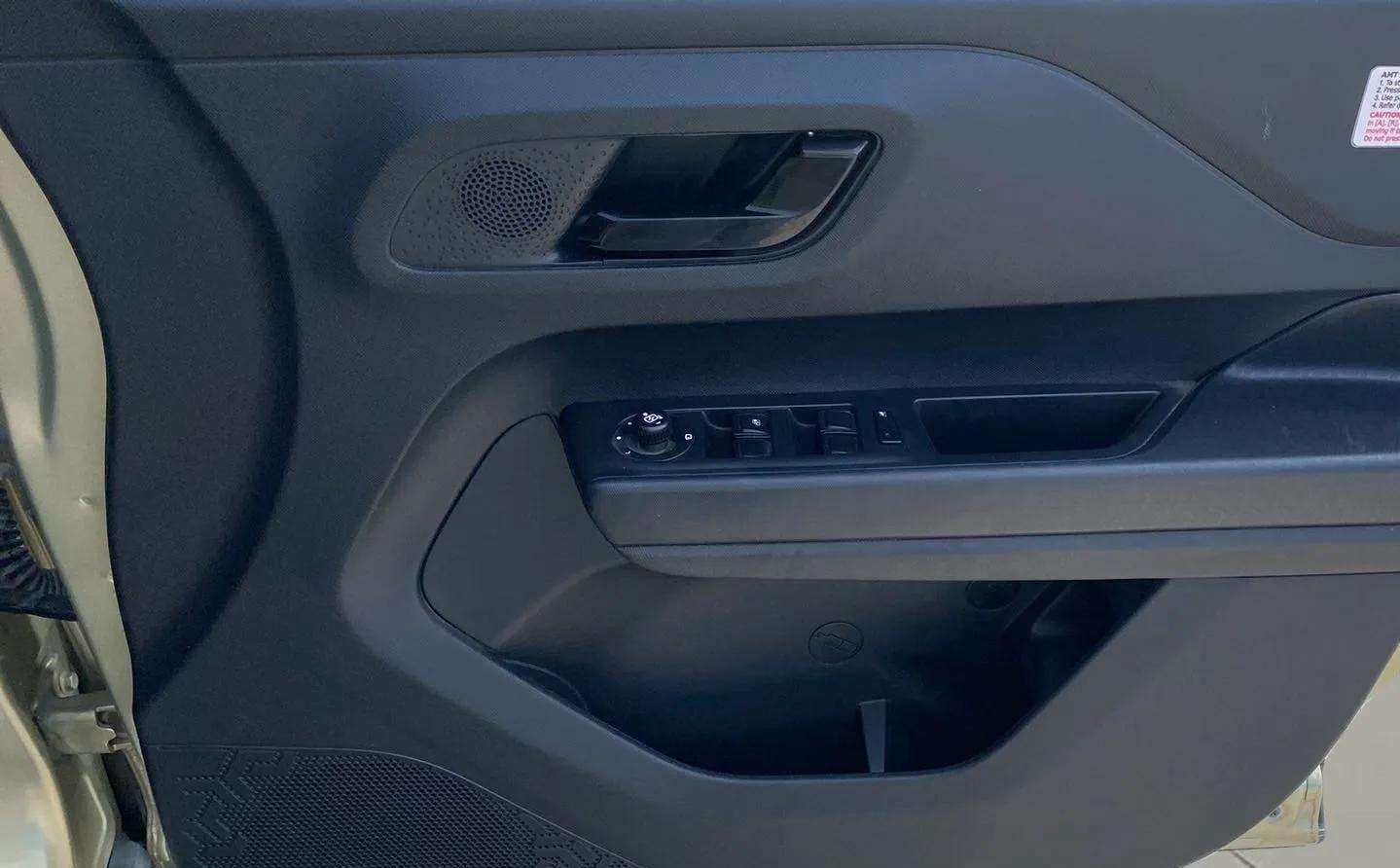 Front driver-side door panel of a Tata Punch