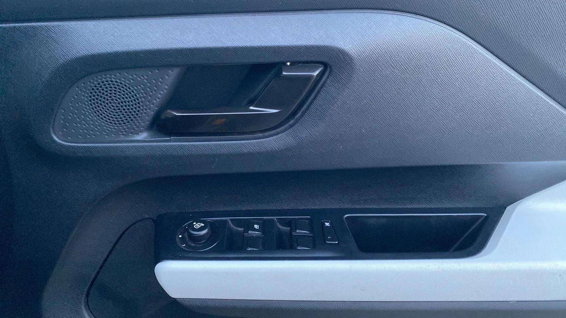 Driver side door panel controls of a Tata Punch