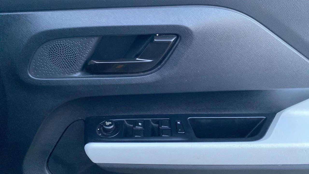Driver side door panel controls of a Tata Punch