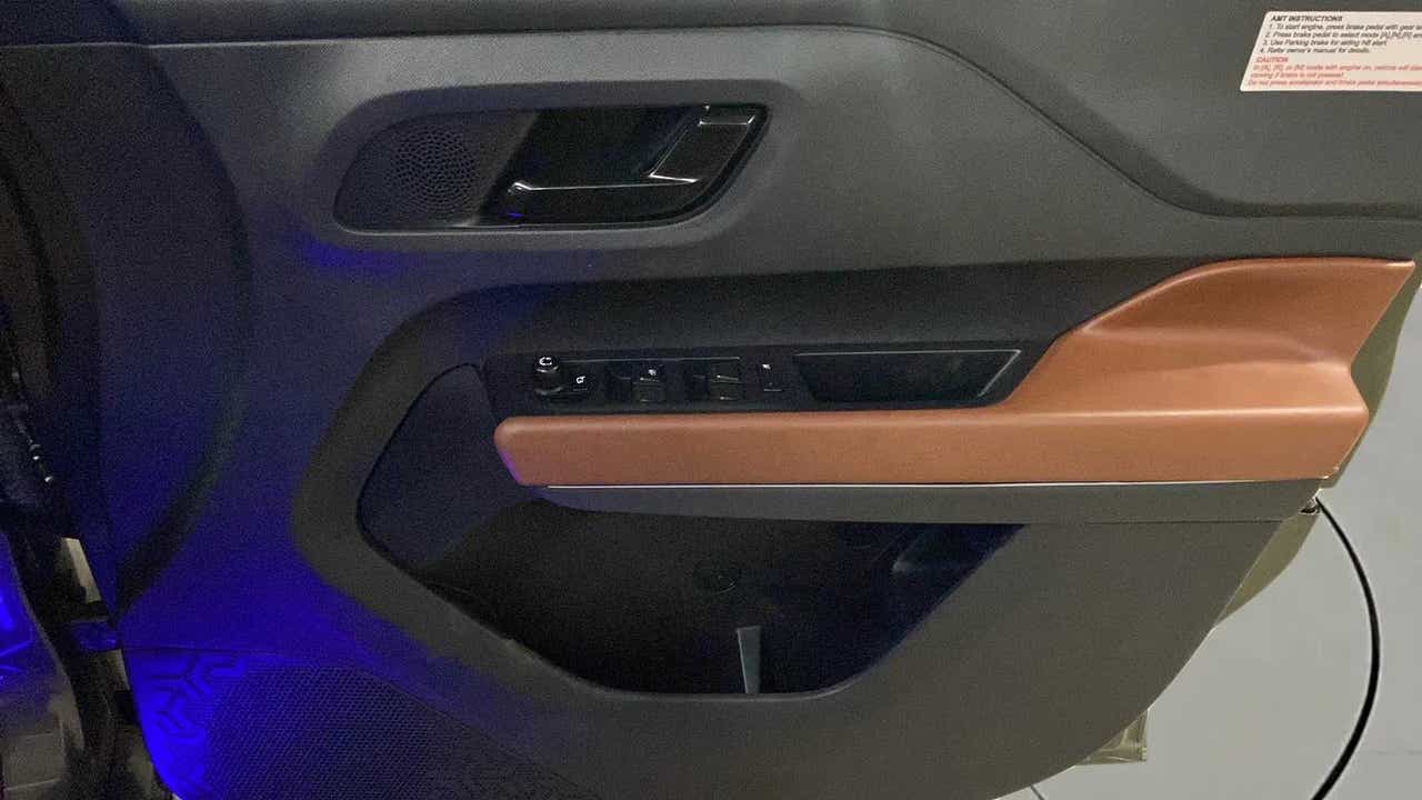 Interior driver side door panel of a Tata Punch