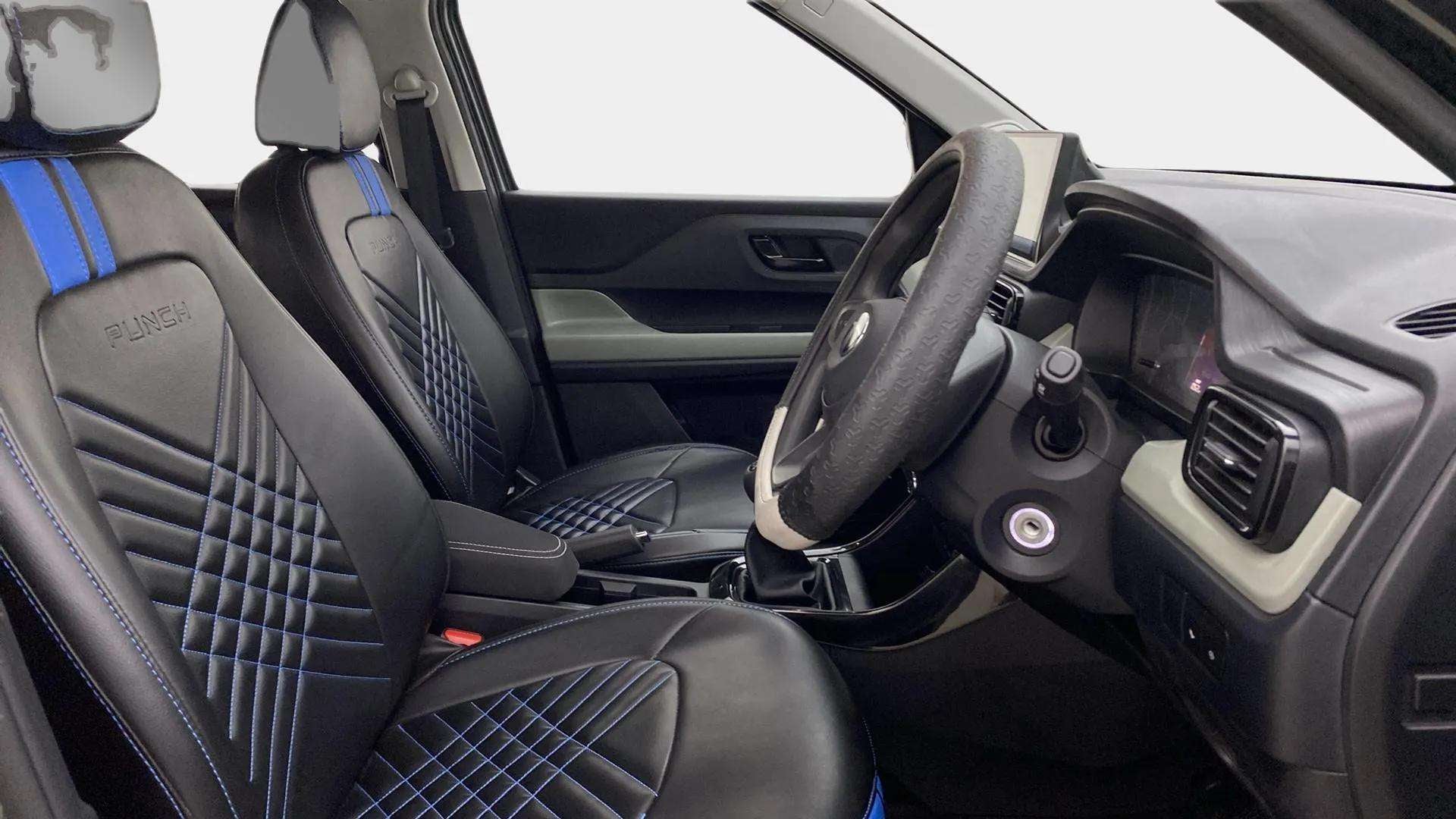 Interior dashboard and front seats of a Tata Punch