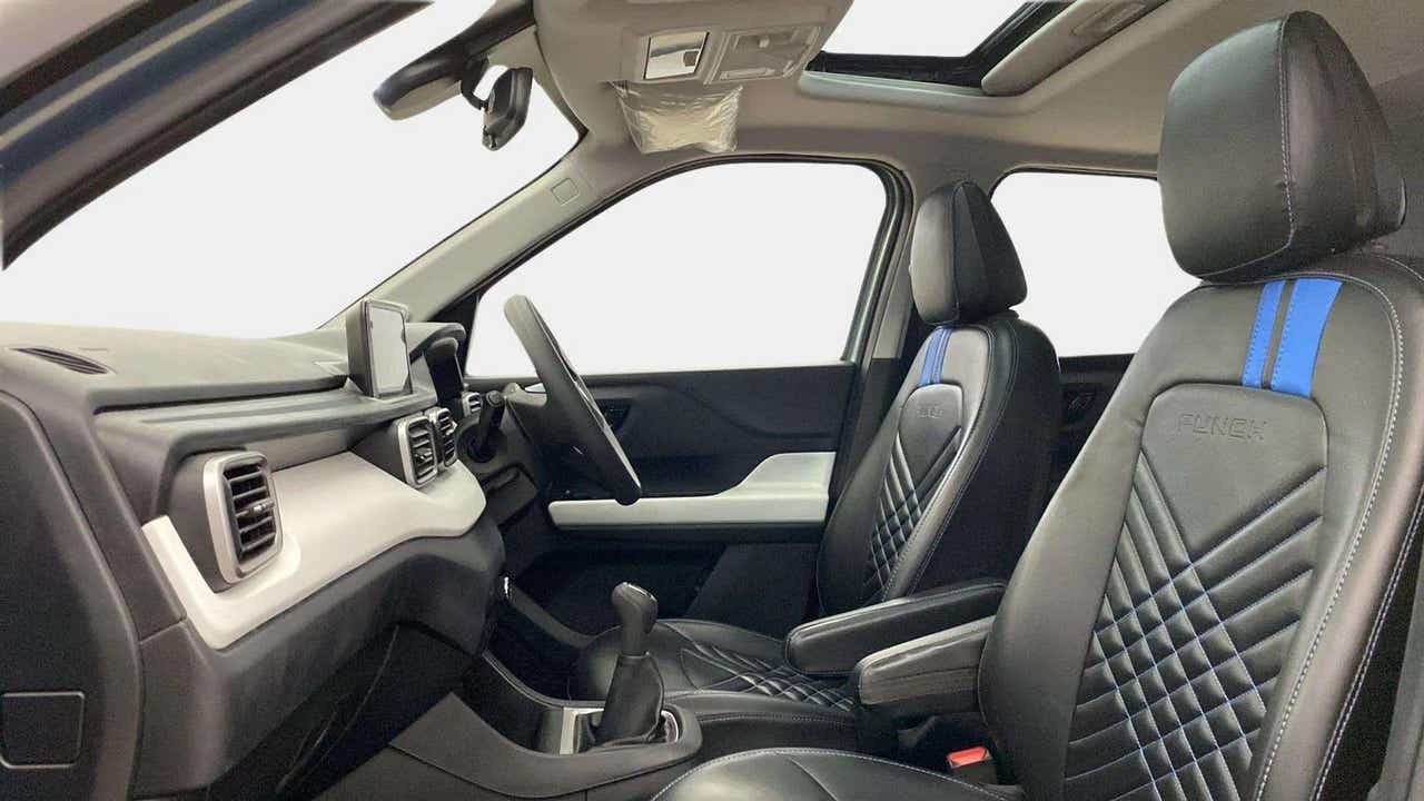 Interior dashboard and front seats of a Tata Punch