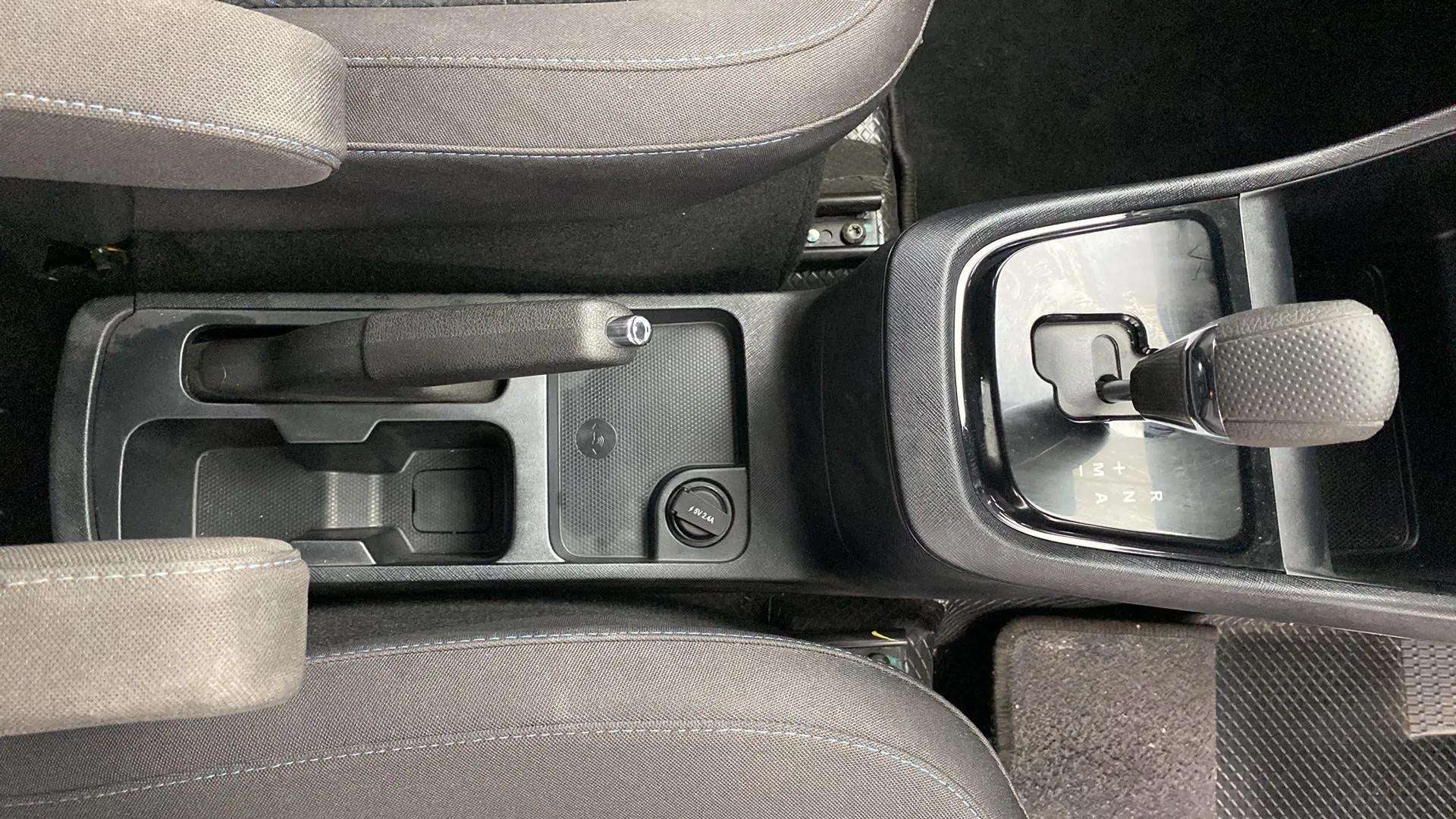 Center console with gear shifter and handbrake of a Tata Punch