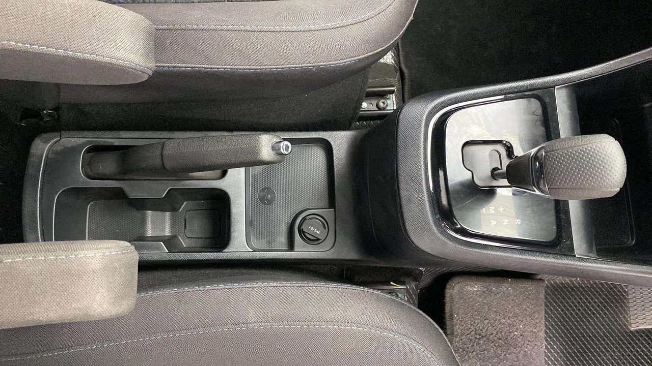 Center console with gear shifter and handbrake of a Tata Punch