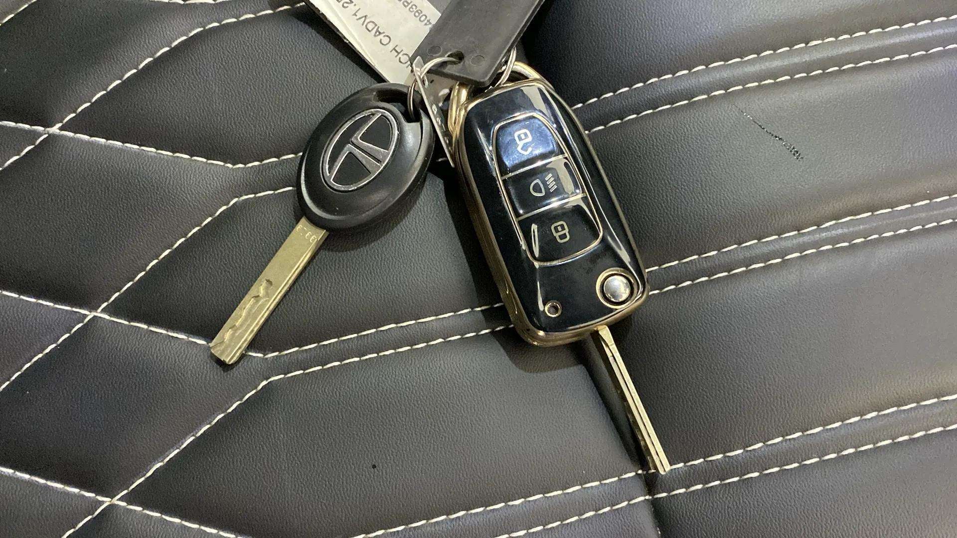 Close-up of a tata punch car key fob on leather seat