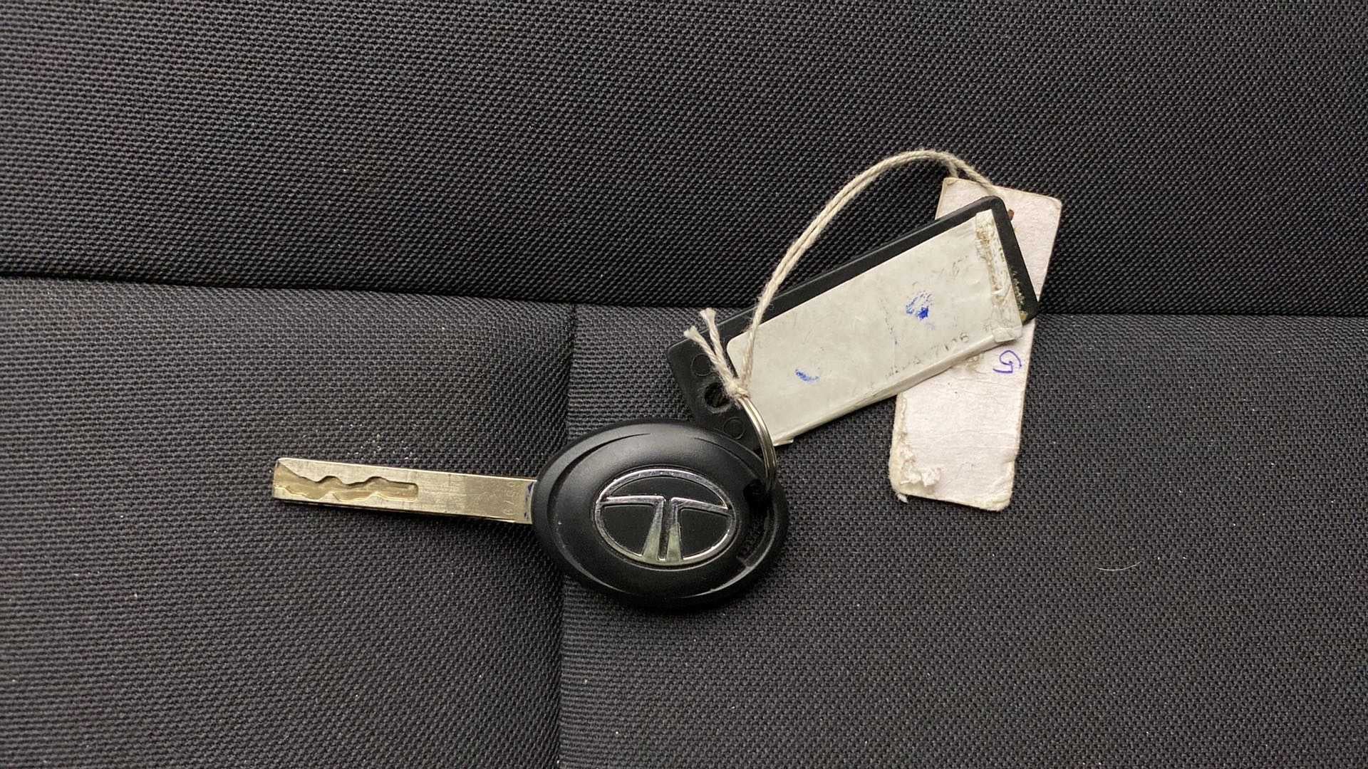 Car key of a Tata Punch on a textured surface
