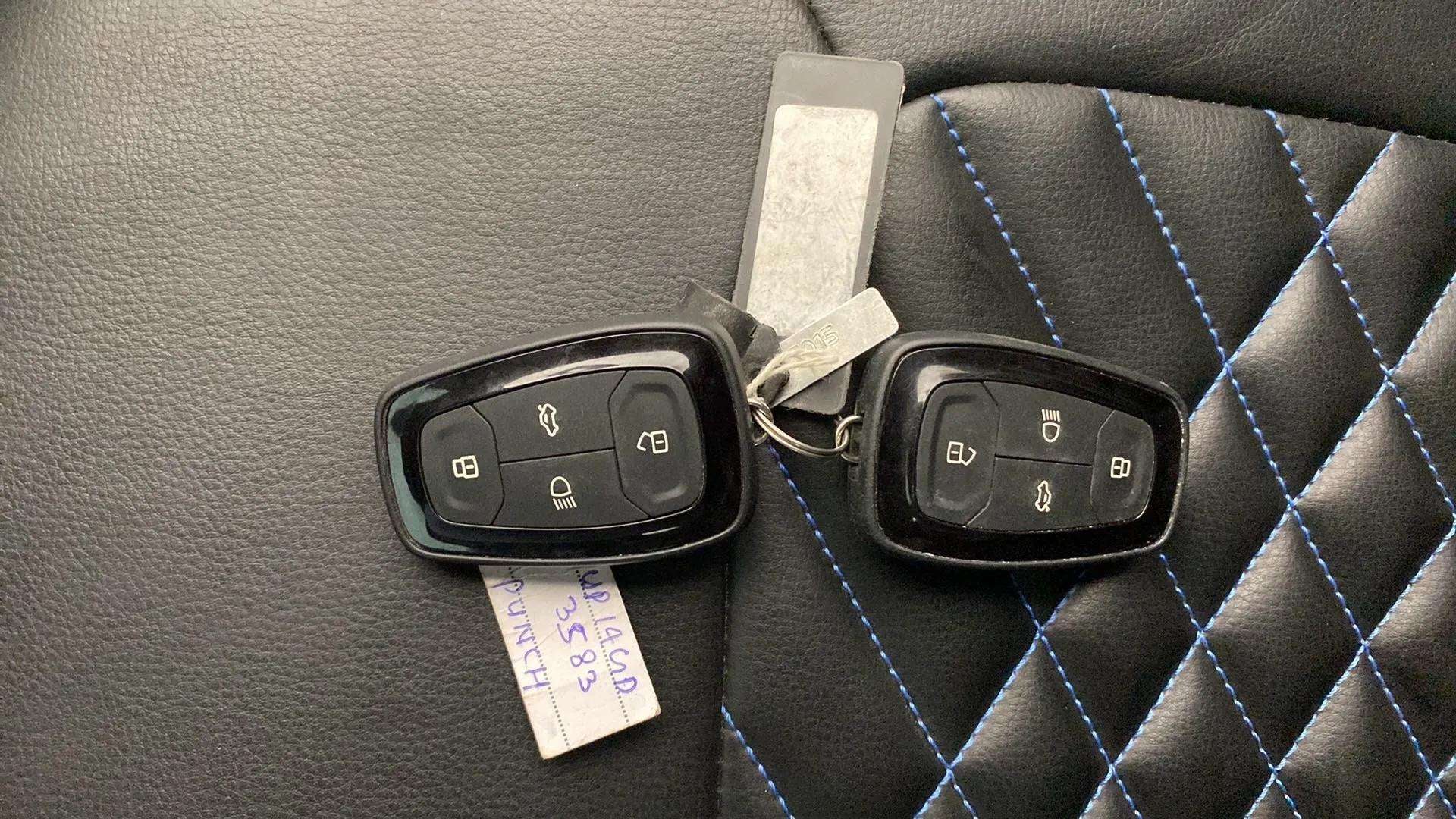 Car key fobs on seat of a Tata Punch