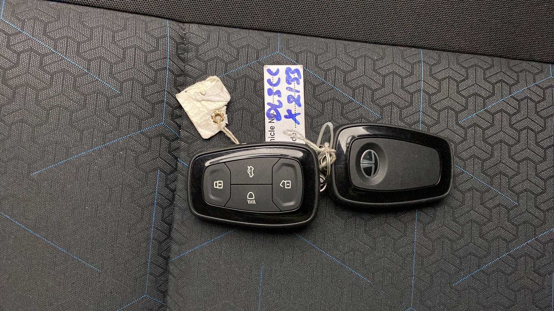 Car key fobs on a seat of a Tata Punch