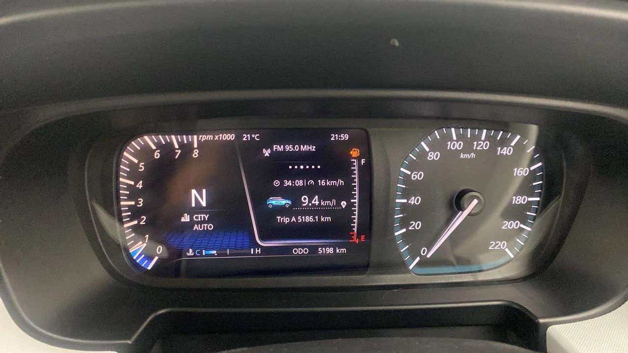 Instrument cluster of a Tata Punch displaying trip and speed details