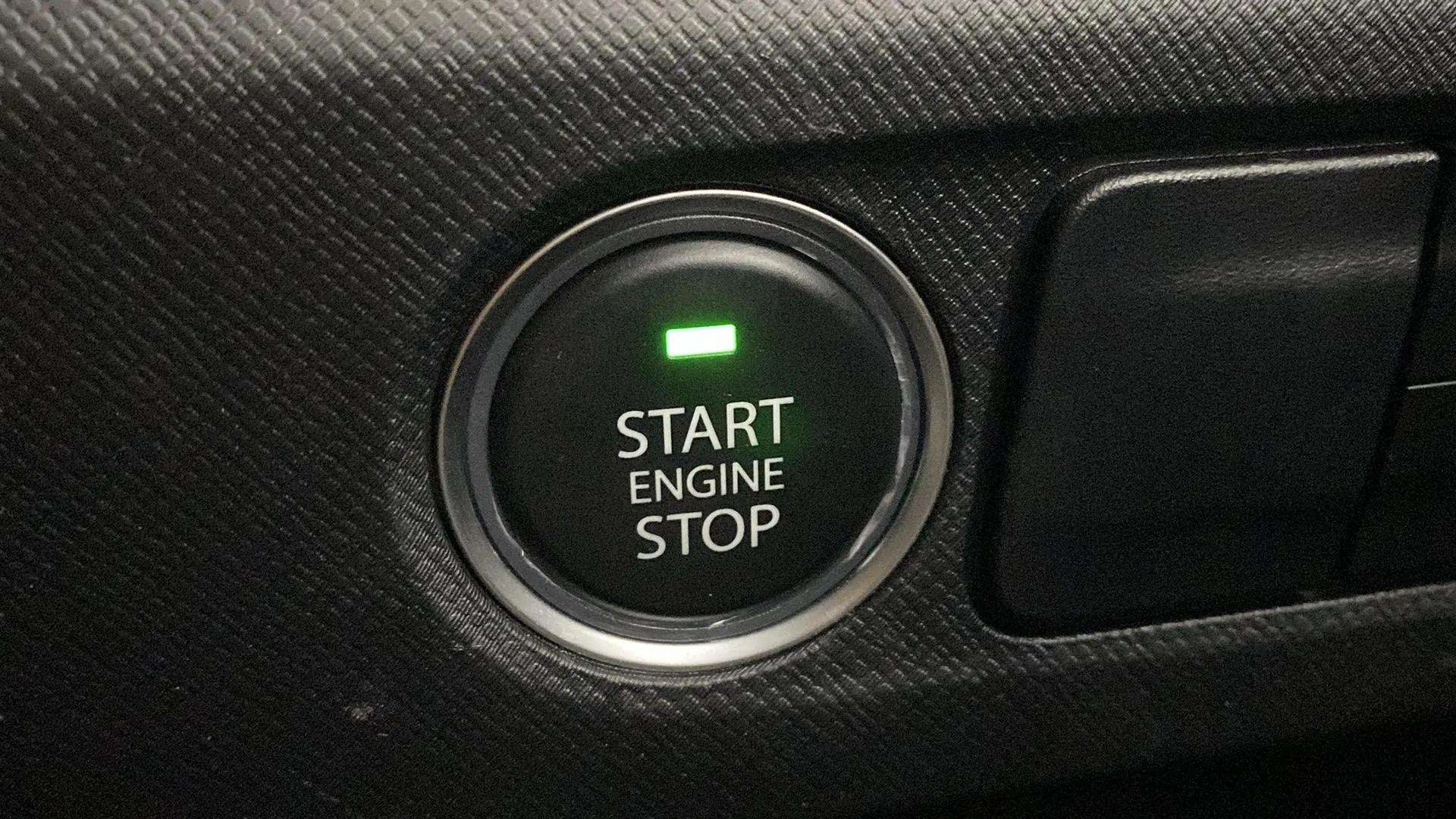 Close-up of the start engine stop button of a Tata Punch