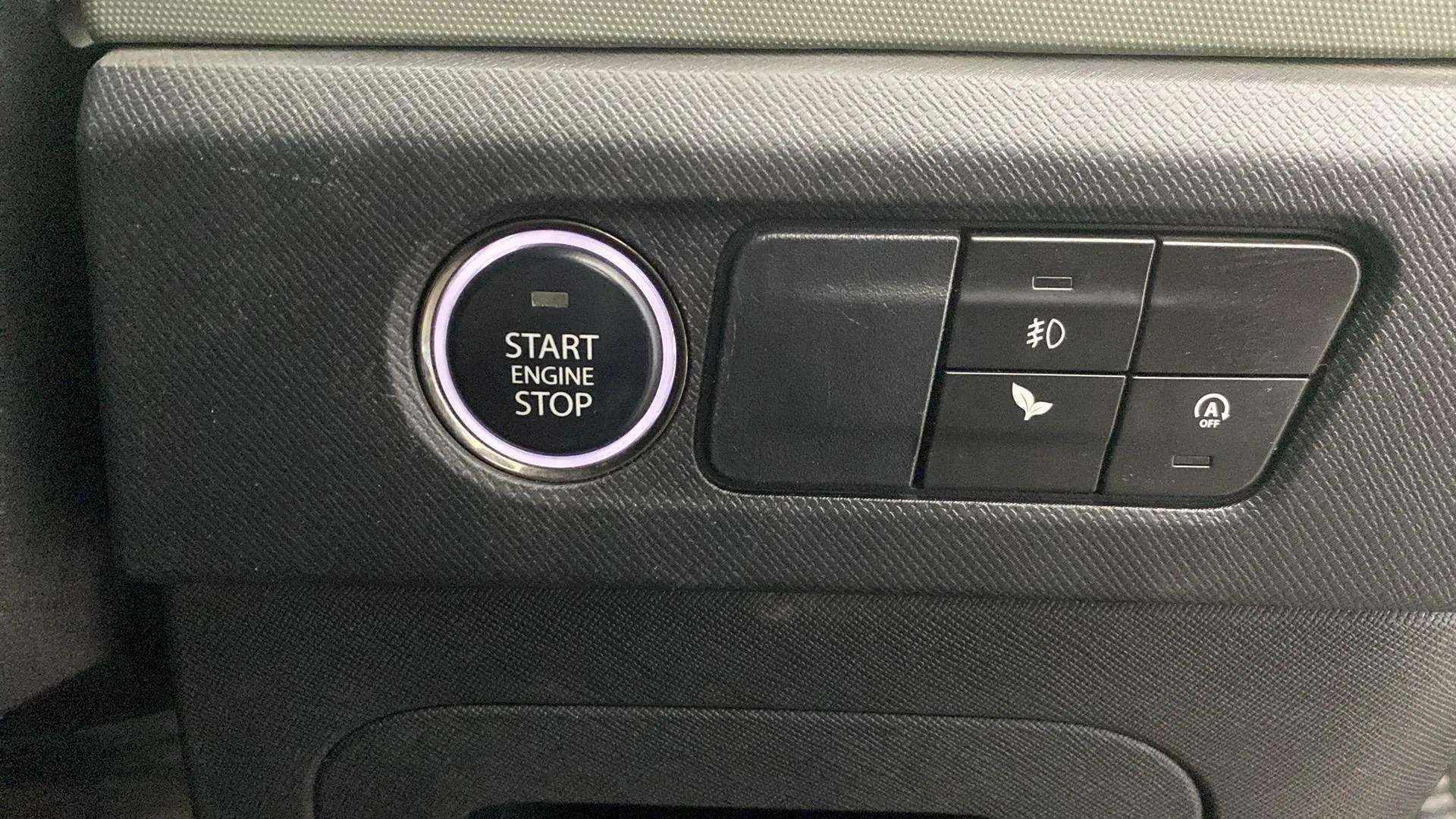 Dashboard controls with start engine stop button of a Tata Punch