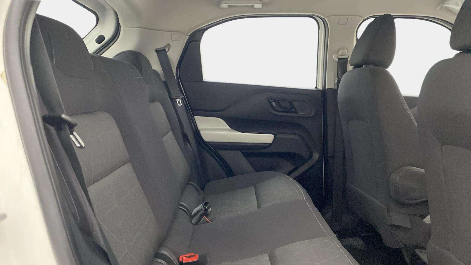 Rear seat and door view of a Tata Punch interior