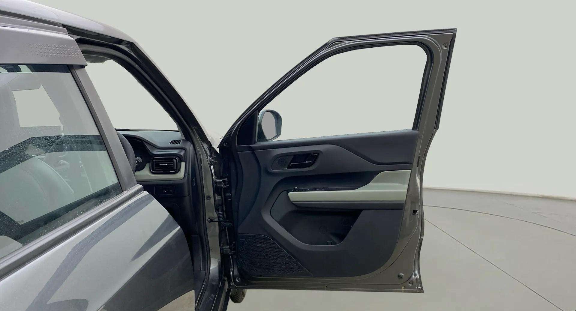 Front driver side door and partial dashboard of a Tata Punch